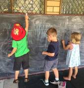 Kids playing on Chalk board