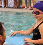 One of our young students listening to her instructor.