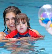 Mom and son in swimming lessons