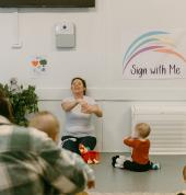Baby and a teacher baby signing