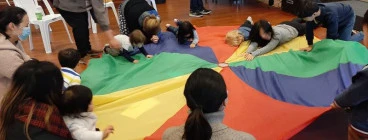 Parachute play always a favourite. Of course it wouldn't be complete without some music and dancing.