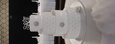 4 tier white and silver wedding cake