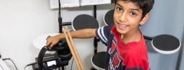 Maxx Music Boy learning drums