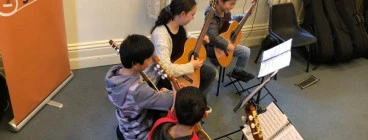 Guitar lessons and ensemble classes for kids.