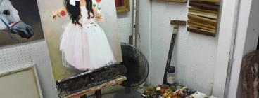 Beautiful girl portrait on easel