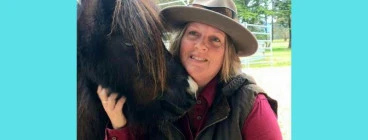 person with miniature horse