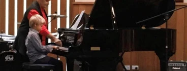 Our lovely grand piano for performances and some lessons