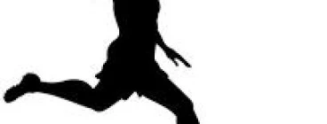 Young woman chasing down a soccer ball