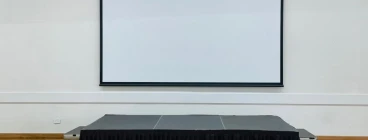 stage with a projector screen on wall