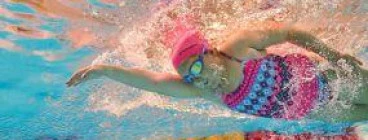 Underwater angle of young girl swimming in pool