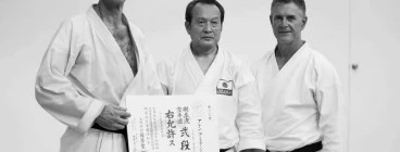 Alan Armitage Sempai with Seiichi Fujiwara Hanshi 8th Dan Gojuryu Karate do Seiwakai and Glenn Stephenson Shihan 6th Dan Gojuryu Karate do Seiwakai with his 2nd Dan Certificate from Japan
