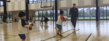 Kids practicing basketball drills with cones and balls at First Pick Basketball training in Melbourne