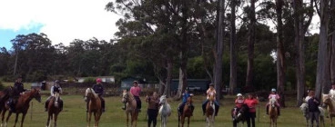 School holiday camp group ride on our hill