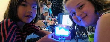 Kids coding robots at our school holiday code camp
