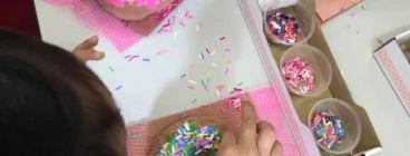 Kids make clay art doughnuts and sprinkle confetti paper, inspired by pop artist Wayne Thiebaud