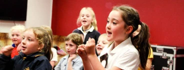 Children bounce out of the car each with absolute joy ready for class