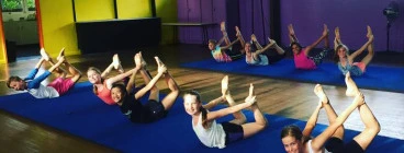 Our Acrodance students strengthening their backs in our colourful studio.