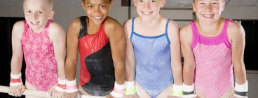 Gymnastics girls on bar in front support