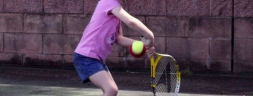 Shire pupil 4 year old Chloe prepares to fire down a topspin backhand