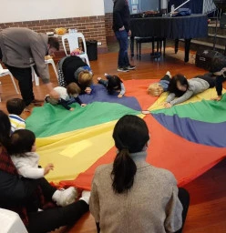 Parachute play always a favourite. Of course it wouldn't be complete without some music and dancing.