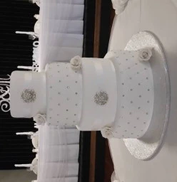 4 tier white and silver wedding cake