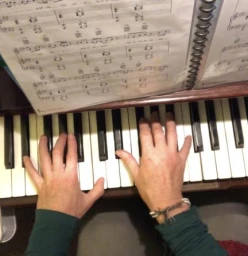 Tara's hands playing piano