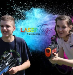 two kids playing laser tag with banner
