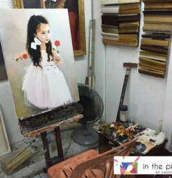 Beautiful girl portrait on easel