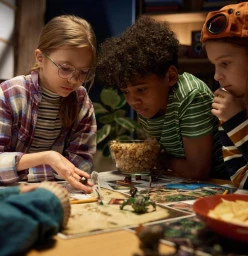 Spectrum Quest kids lean in on an intense dice roll!