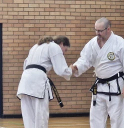 Master Troy Presenting Fist dan Black Belt