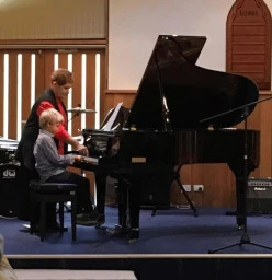 Our lovely grand piano for performances and some lessons