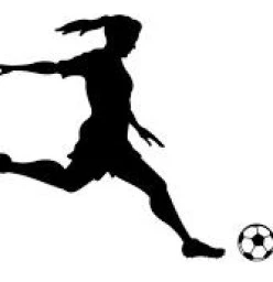 Young woman chasing down a soccer ball