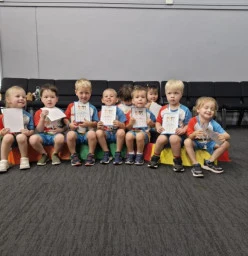 Proud kids with their end of term certificates