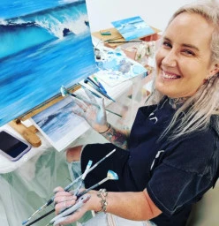 Naomi with her first oil painting.