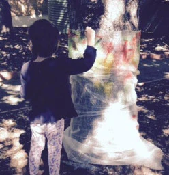 Painting the tree wrapped in bubble wrap!