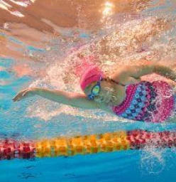 Underwater angle of young girl swimming in pool
