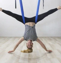 Aerial Yoga boasts numerous health benefits such as increased muscular flexibility, core strengthening, upper and lower body muscular strengthening, increased joint mobility, low impact cardiovascular conditioning, realignment of the spine and because of 
