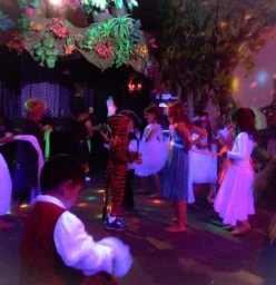 Kids dressed up and having fun at one of our glow in the dark Birthday disco parties.