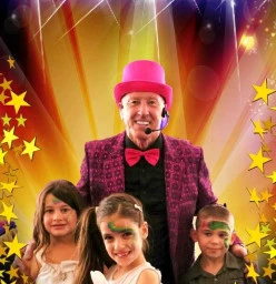 Tony with three children at a Luna Park Holy Communion