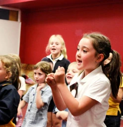 Children bounce out of the car each with absolute joy ready for class
