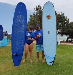 Surfing is great fun to share with a friend!