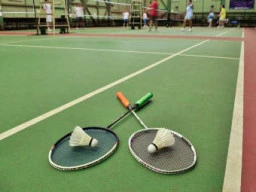 A kid playing badminton