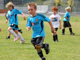 Children in a school holiday soccer camp