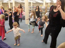 Moms and kids during a ballroom dance lesson